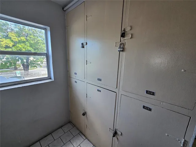 a bathroom with a toilet a sink and shower