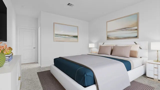 a bedroom with a bed and painting on the wall