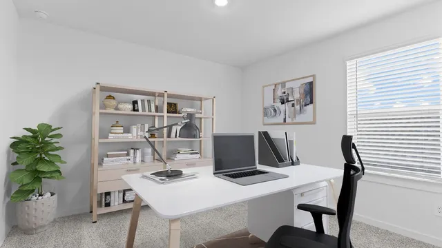 a view of a workspace with furniture