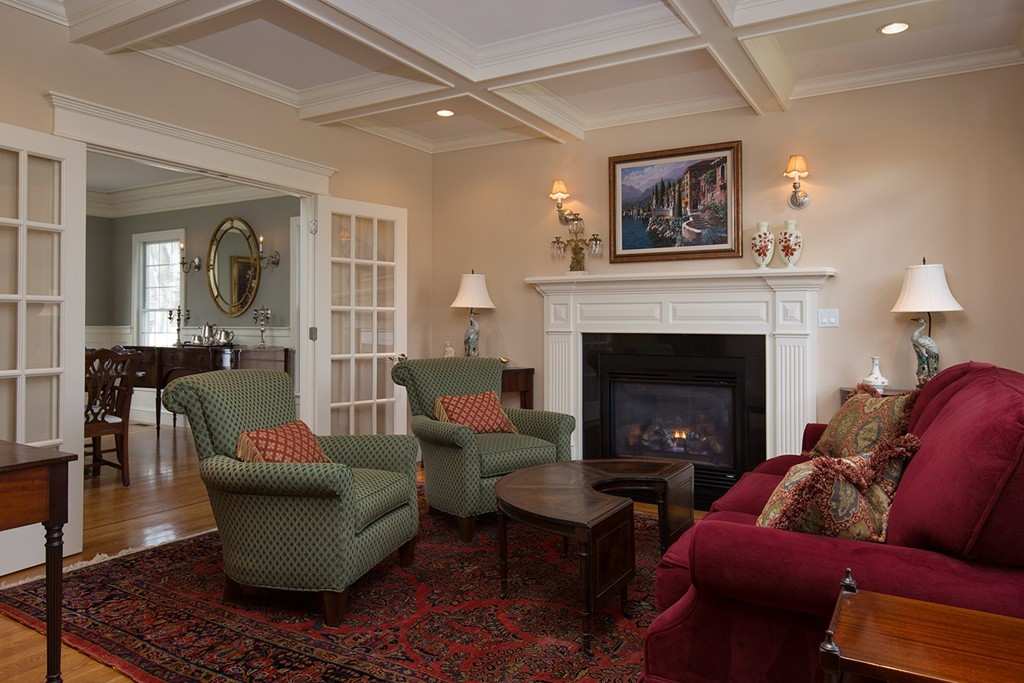 44 Shirley Road Wellesley, MA 02482 - Photo 3 of 13 a living room with furniture and a fireplace