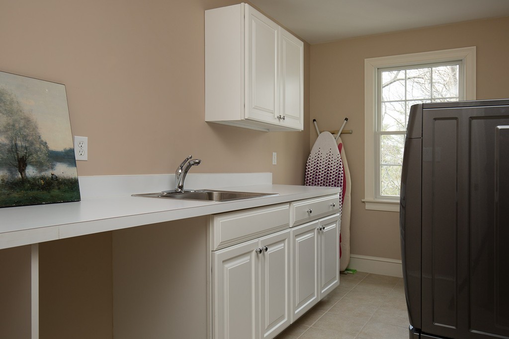 44 Shirley Road Wellesley, MA 02482 - Photo 8 of 13 a kitchen with a sink and cabinets