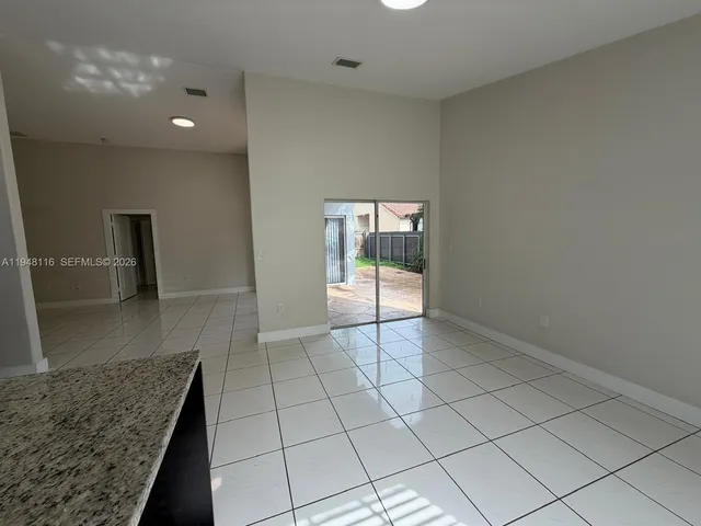 a view of an empty room and window