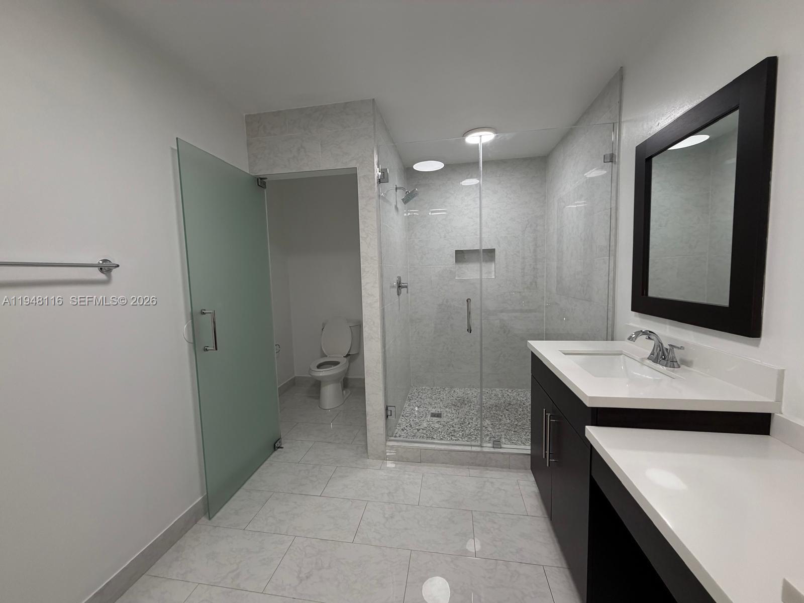 9125 Southwest 166th Avenue Miami, FL 33196 - Photo 13 of 25 a bathroom with a sink a toilet and shower