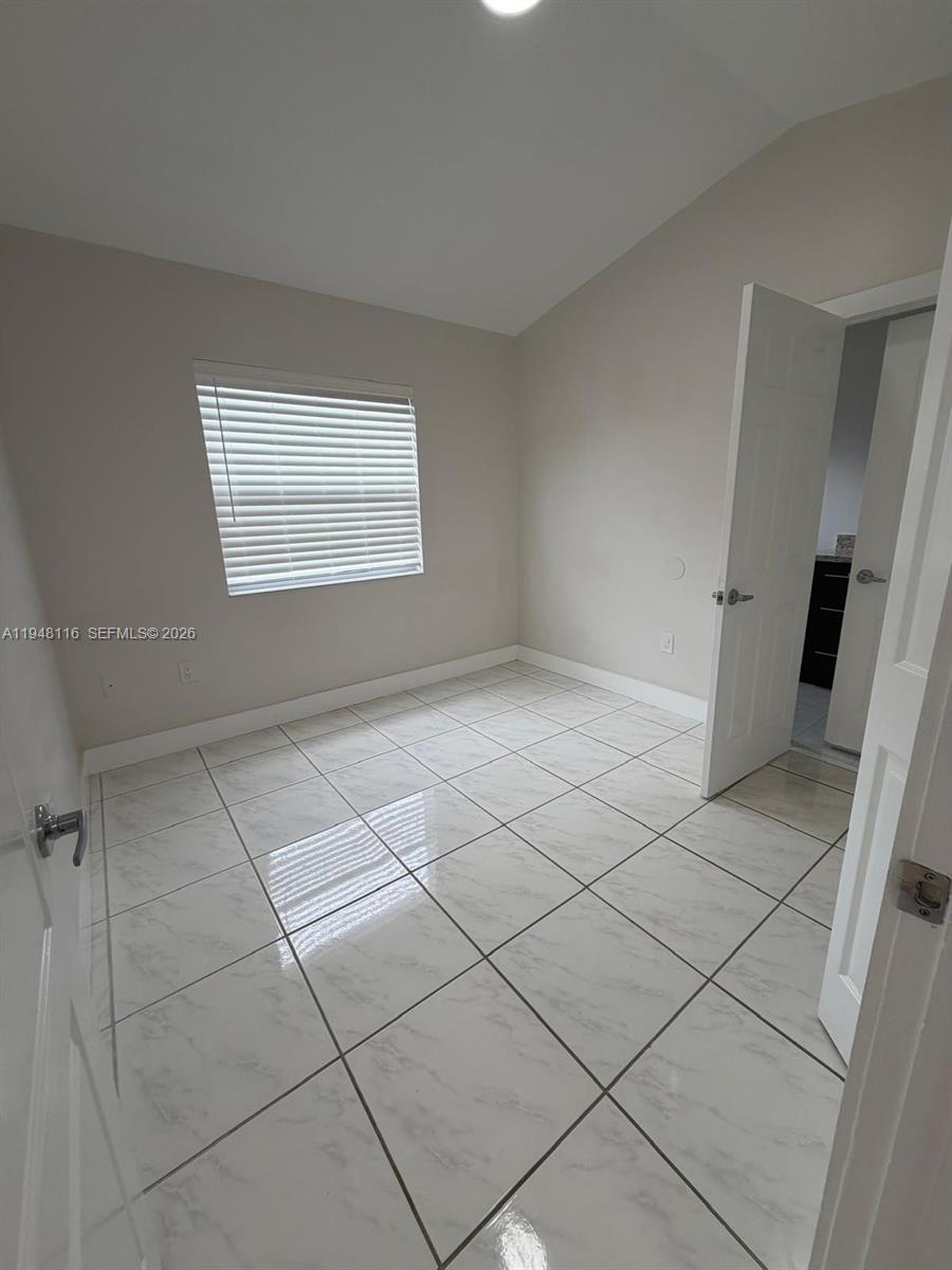 9125 Southwest 166th Avenue Miami, FL 33196 - Photo 15 of 25 a view of an empty room and a window