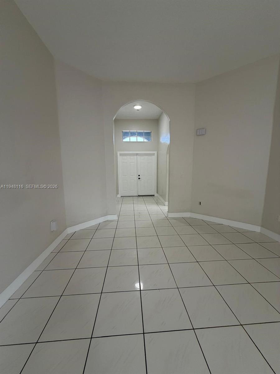 9125 Southwest 166th Avenue Miami, FL 33196 - Photo 18 of 25 a view of an empty room and window