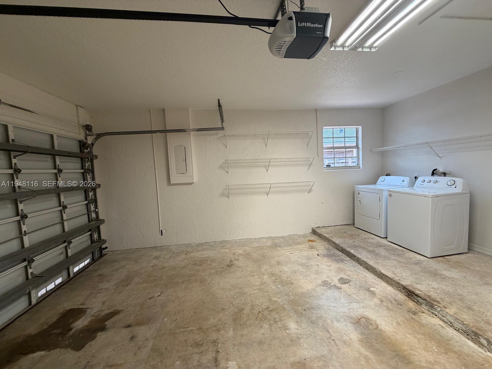 9125 Southwest 166th Avenue Miami, FL 33196 - Photo 20 of 25 a room with a cabinet and a window