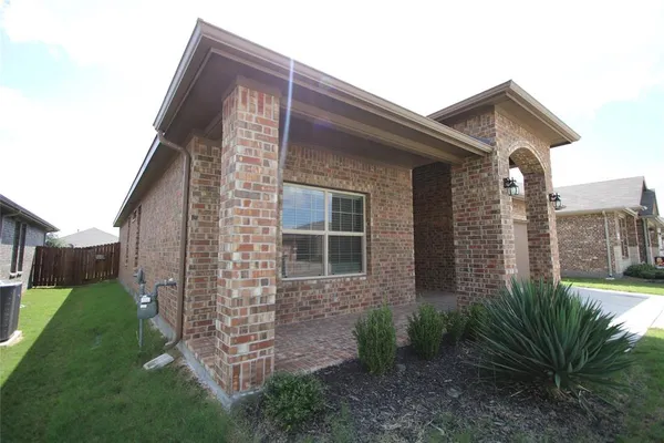 a brick house with a large windows