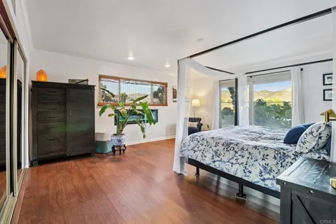 a white toilet sitting next to a shower curtain