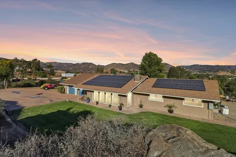 a aerial view of a house with a yard