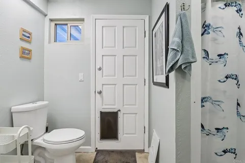 a view of a porch with furniture and garden