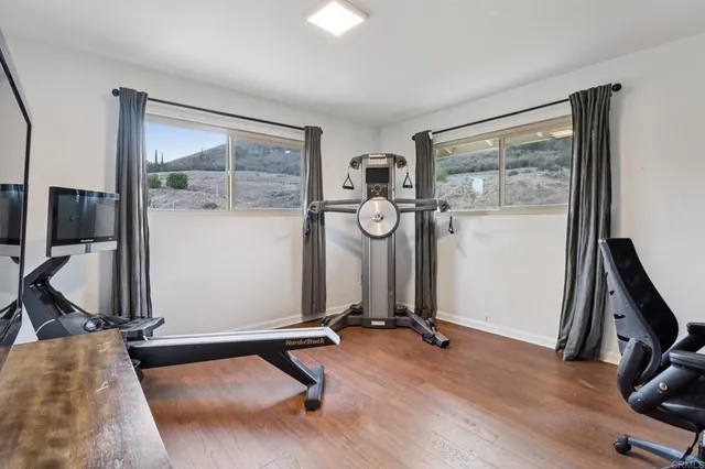 a view of a porch with chairs and backyard