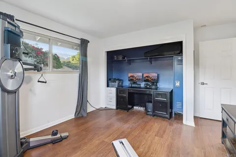 a view of a patio with a table and chairs