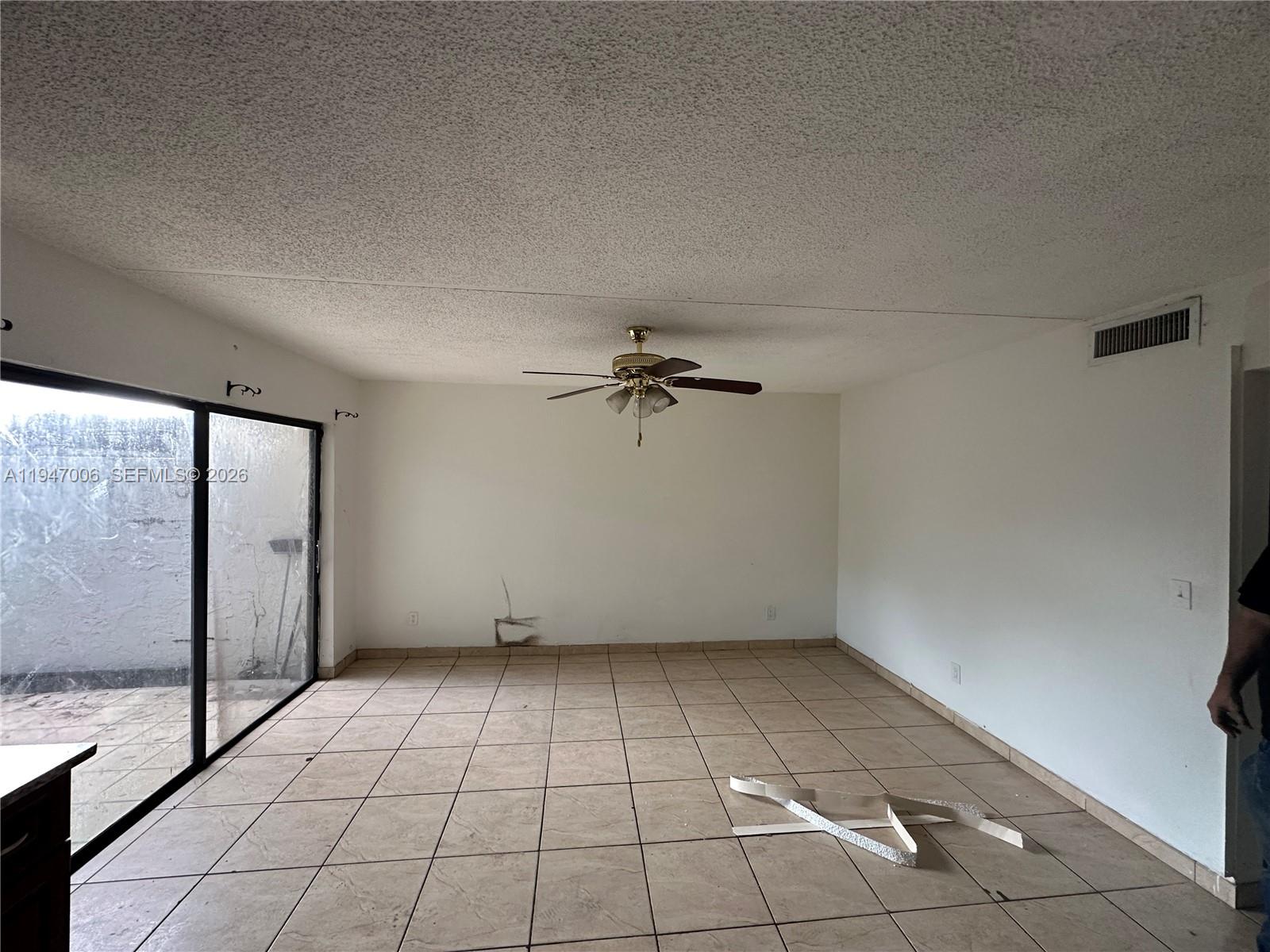 6824 Southwest 37th Street, Unit 6E Miramar, FL 33023 - Photo 3 of 9 a view of an empty room with a window
