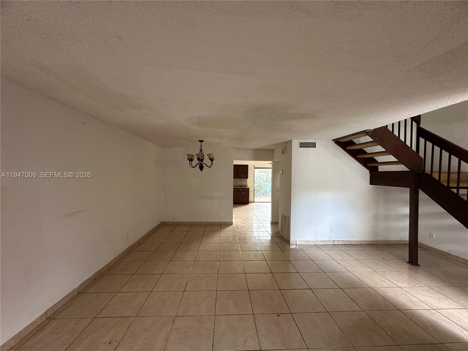 6824 Southwest 37th Street, Unit 6E Miramar, FL 33023 - Photo 4 of 9 a view of an entryway with wooden floor