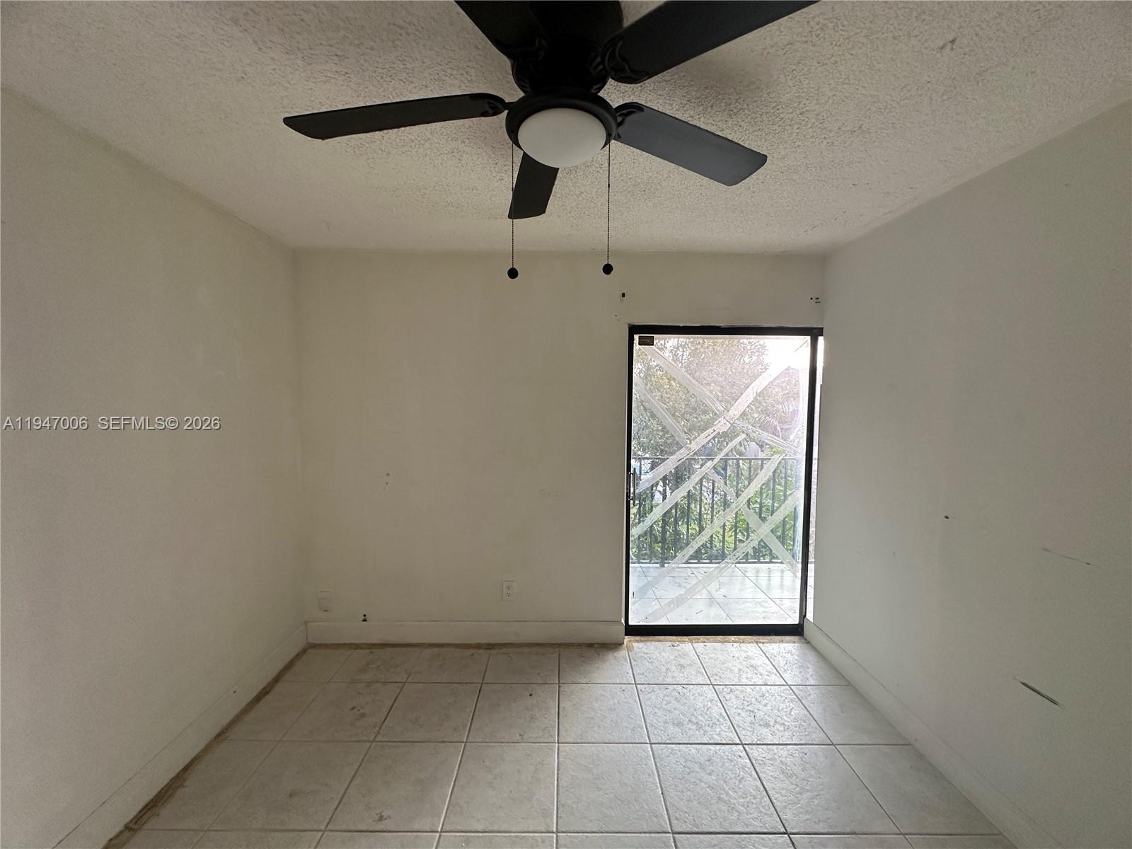 6824 Southwest 37th Street, Unit 6E Miramar, FL 33023 - Photo 8 of 9 a view of an empty room with a window