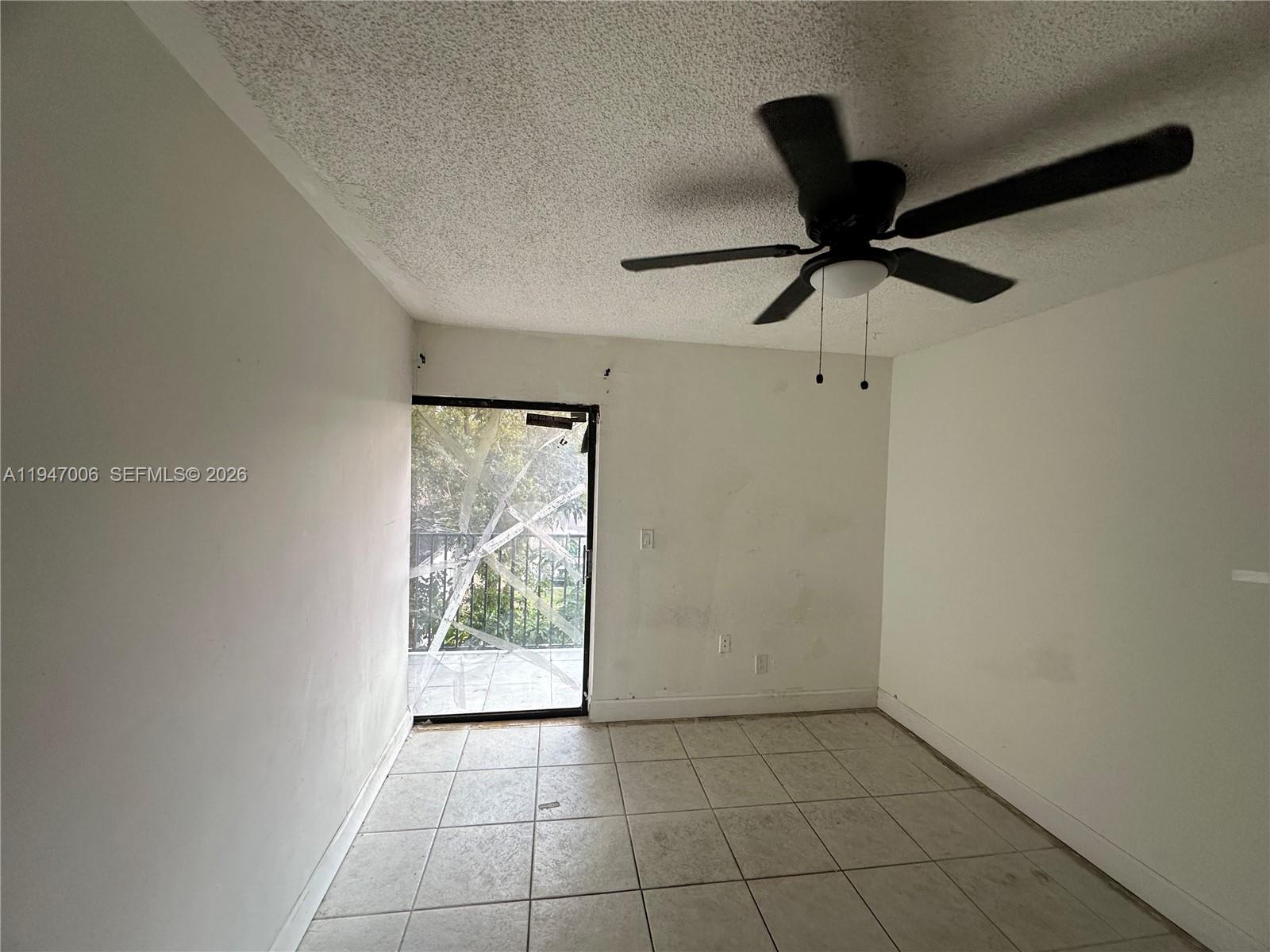 6824 Southwest 37th Street, Unit 6E Miramar, FL 33023 - Photo 9 of 9 a view of an empty room with a window