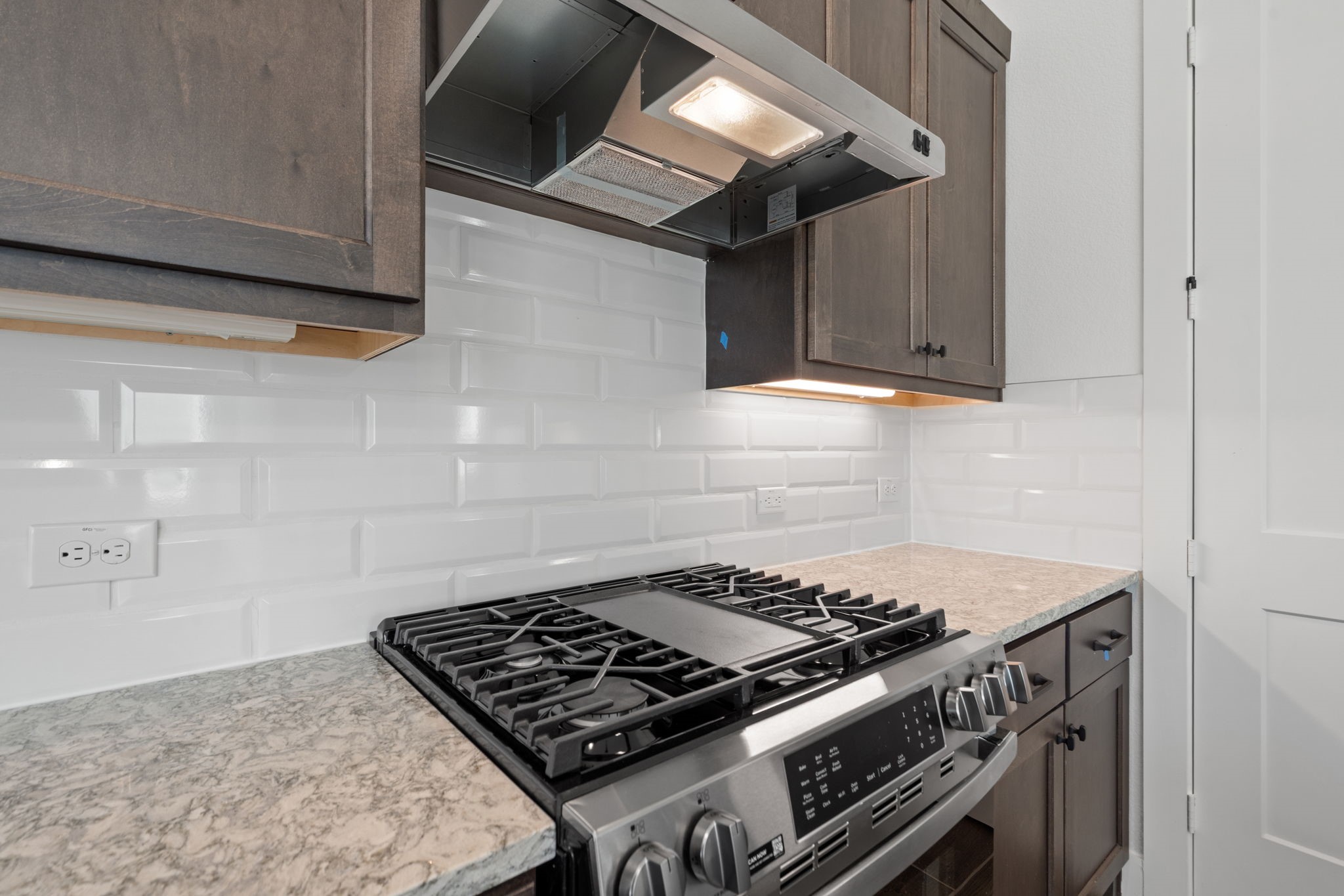 12002 Rice View Drive Mont Belvieu, TX 77523 - Photo 11 of 50 a stove top oven sitting inside of a kitchen