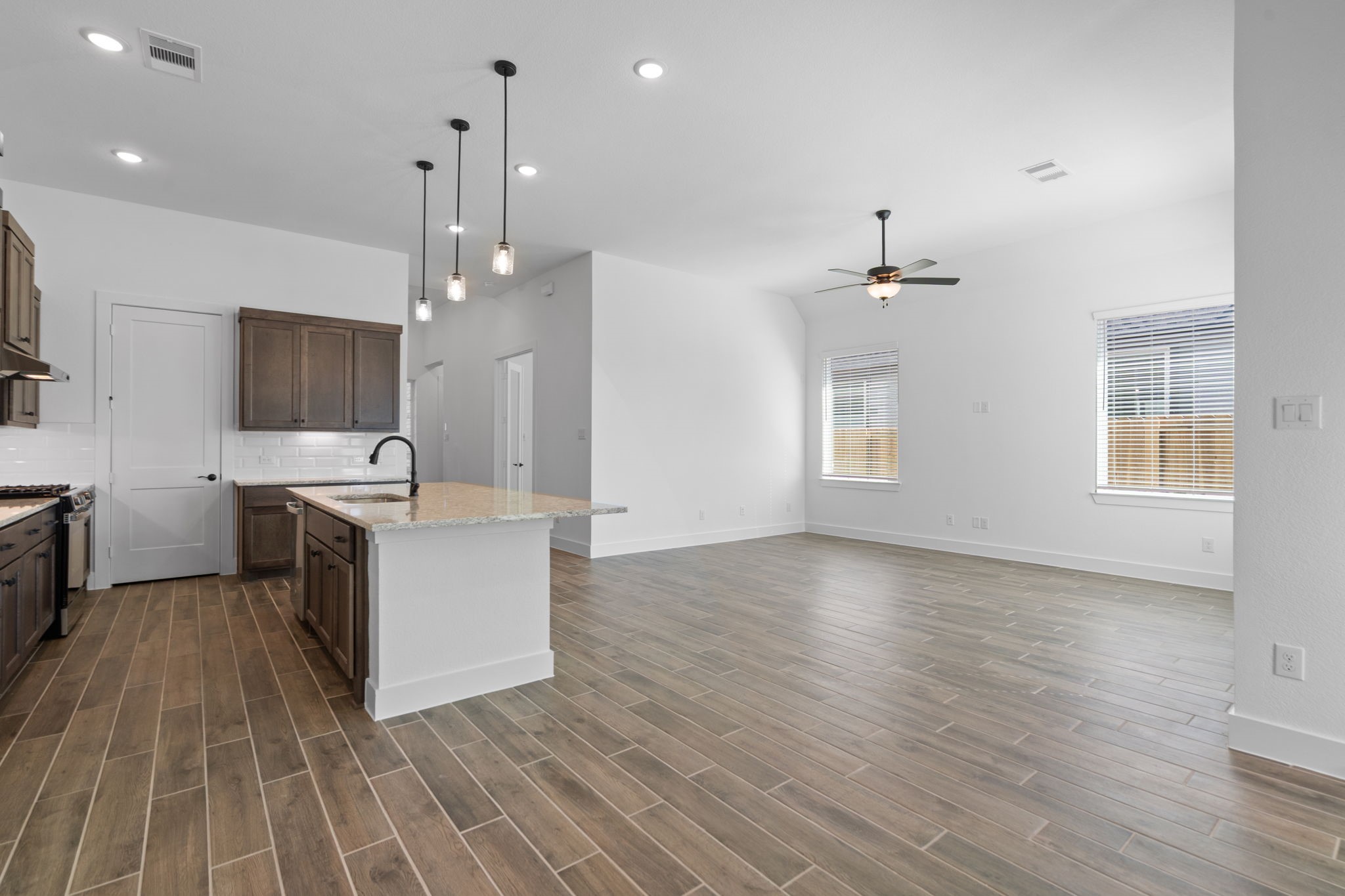 12002 Rice View Drive Mont Belvieu, TX 77523 - Photo 14 of 50 an open kitchen with sink and cabinets