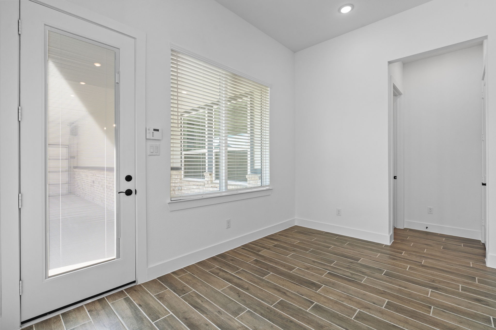 12002 Rice View Drive Mont Belvieu, TX 77523 - Photo 15 of 50 a view of a room with wooden floor and window