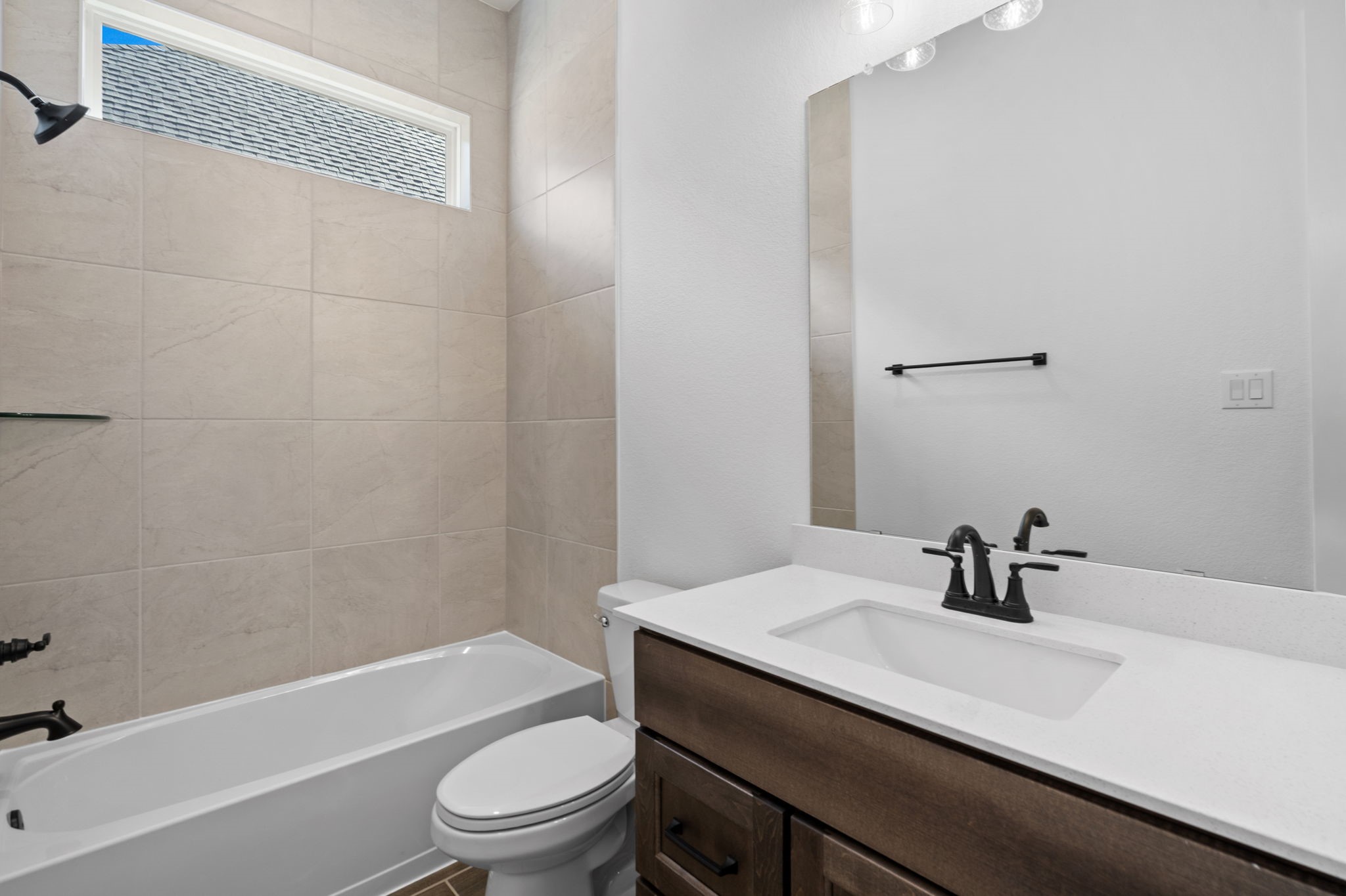 12002 Rice View Drive Mont Belvieu, TX 77523 - Photo 26 of 50 a bathroom with a sink a toilet and a bathtub