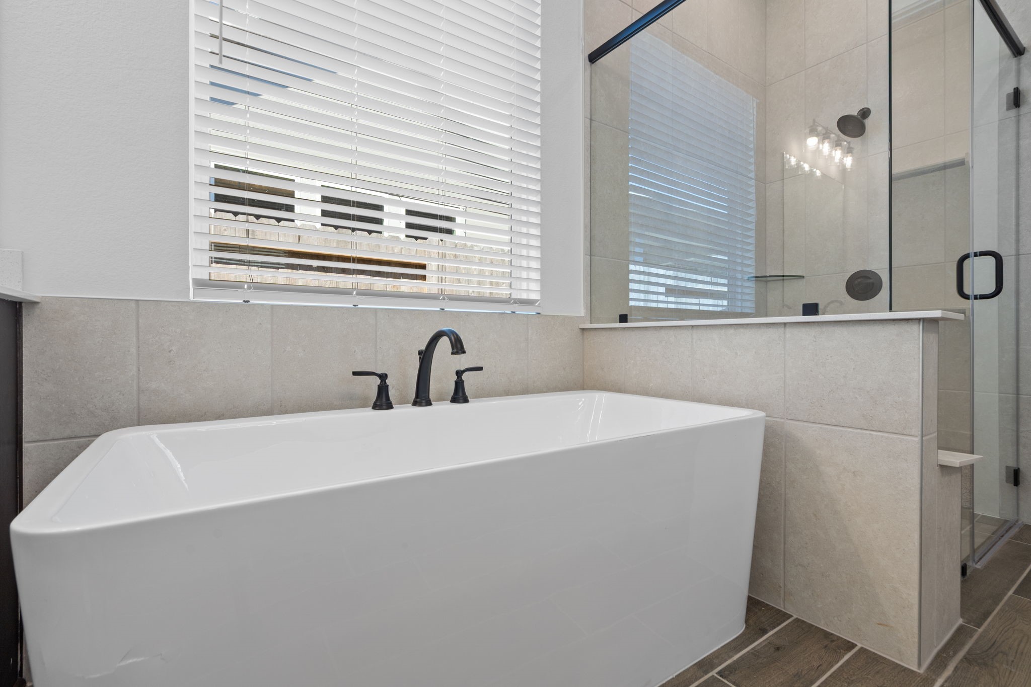 12002 Rice View Drive Mont Belvieu, TX 77523 - Photo 31 of 50 a bathroom with a bathtub and a sink