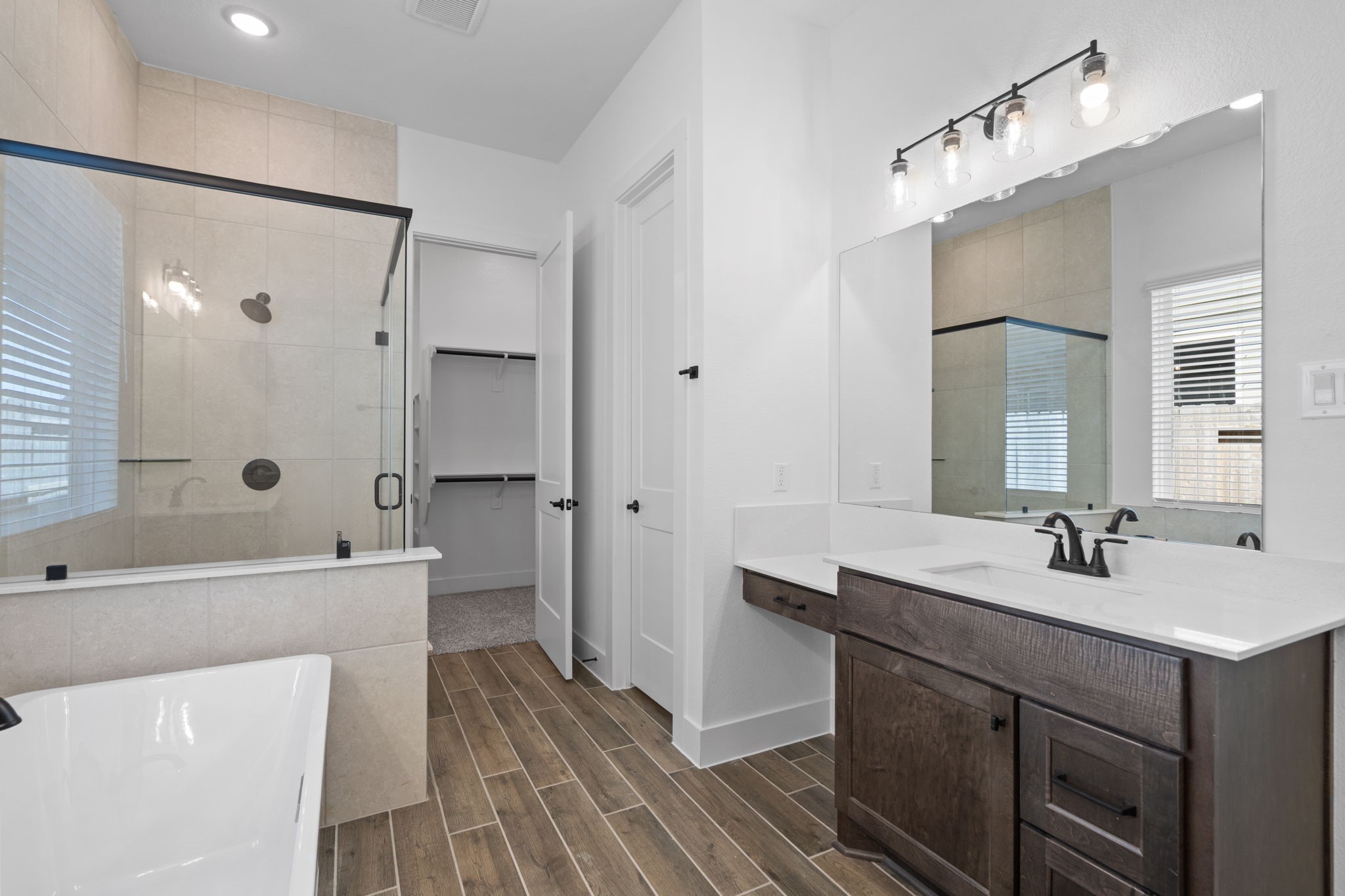 12002 Rice View Drive Mont Belvieu, TX 77523 - Photo 33 of 50 a bathroom with a double vanity sink mirror double and shower