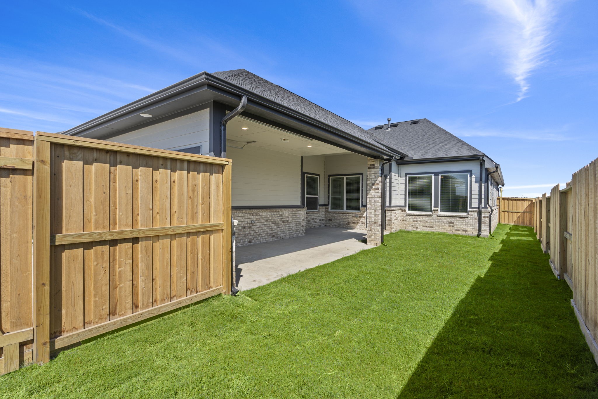 12002 Rice View Drive Mont Belvieu, TX 77523 - Photo 38 of 50 a view of a backyard with plants and a backyard