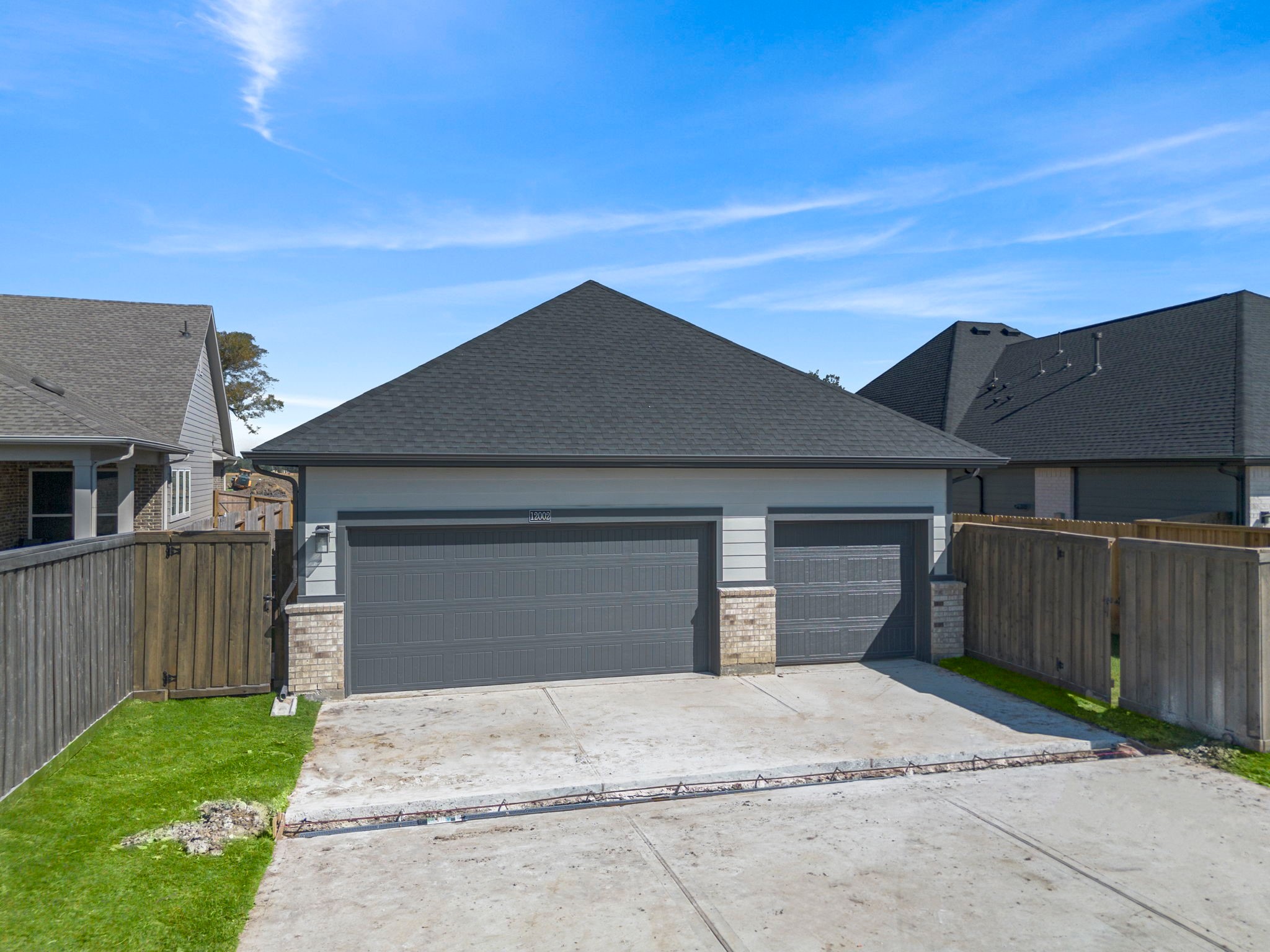 12002 Rice View Drive Mont Belvieu, TX 77523 - Photo 5 of 50 a front view of a house with a yard and garage