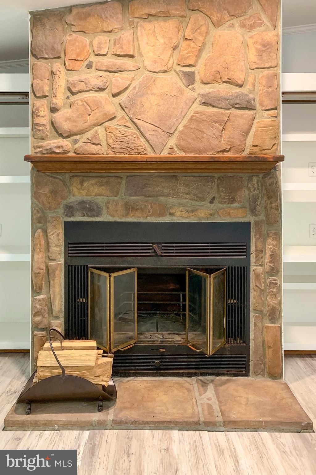 32474 Falling Point Road Dagsboro, DE 19939 - Photo 18 of 46 Wood burning fire place, with stone facing.