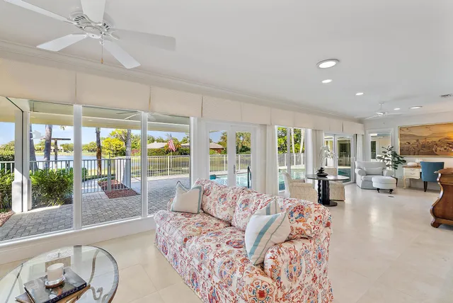 a view of a living room and floor to ceiling window