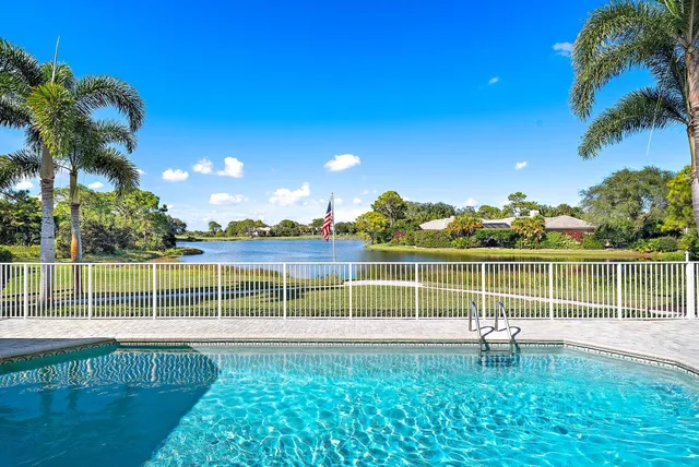 a bed room with a bed and a large window