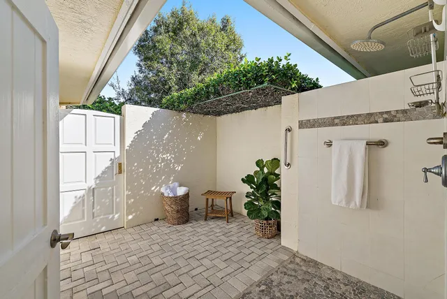 a living room with furniture potted plant and a window