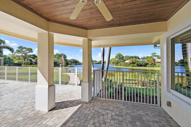 an aerial view of a house with a garden and swimming pool