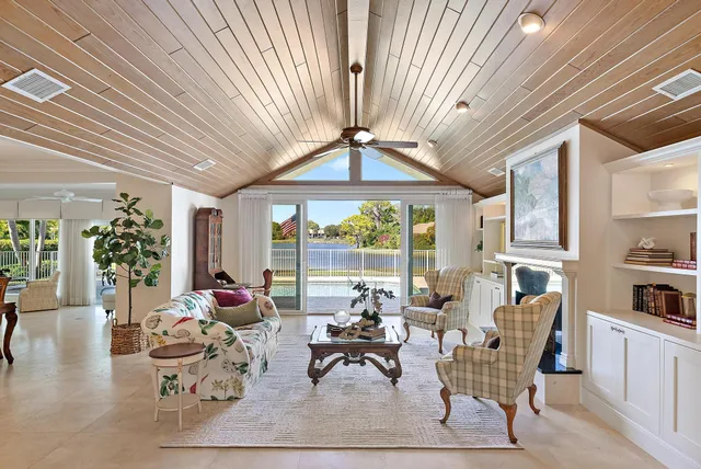 a kitchen with stainless steel appliances granite countertop a stove top oven a refrigerator a sink and dishwasher