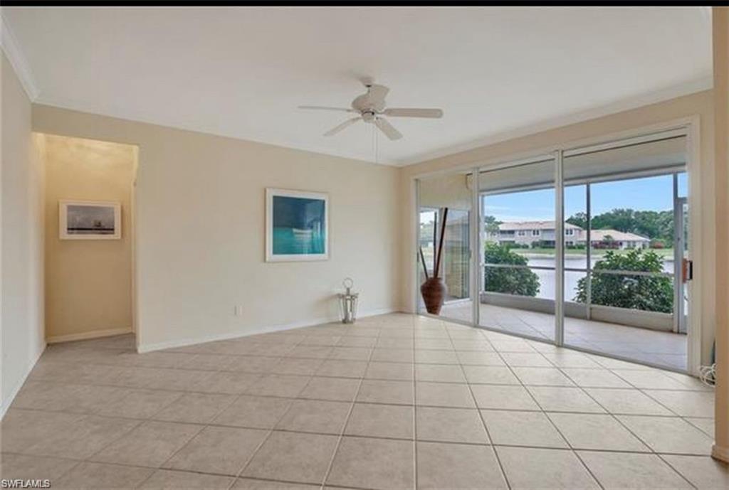 298 Emerald Bay Circle, Unit K6 Naples, FL 34110 - Photo 2 of 9 a view of an empty room with a window
