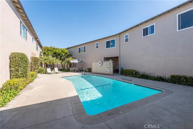 a view of a pathway with flower garden