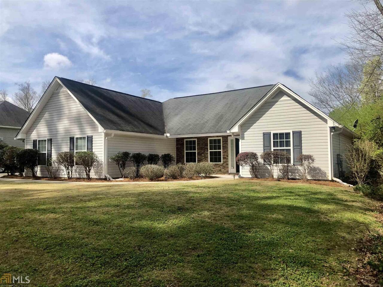 106 Mt Alto Road Southwest Rome, GA 30165 - Photo 1 of 1 a front view of a house with a garden