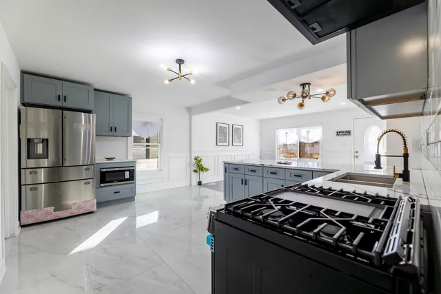 a kitchen with a stove and a refrigerator