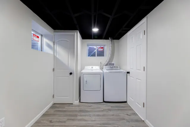 a view of a hallway with washer and dryer