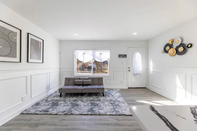 a living room with furniture and a rug