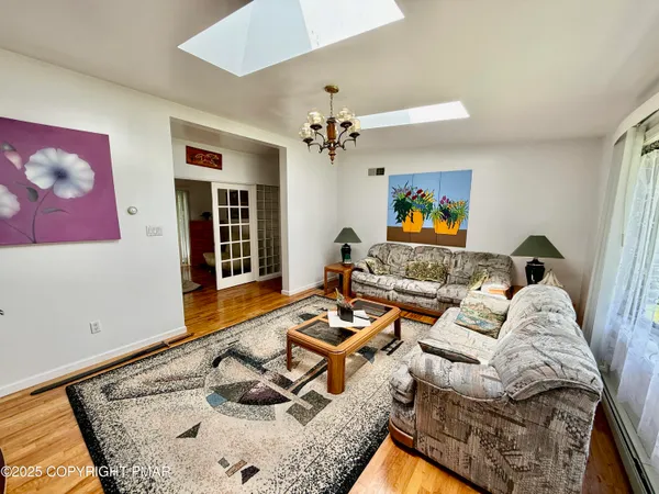 a living room with furniture and a window