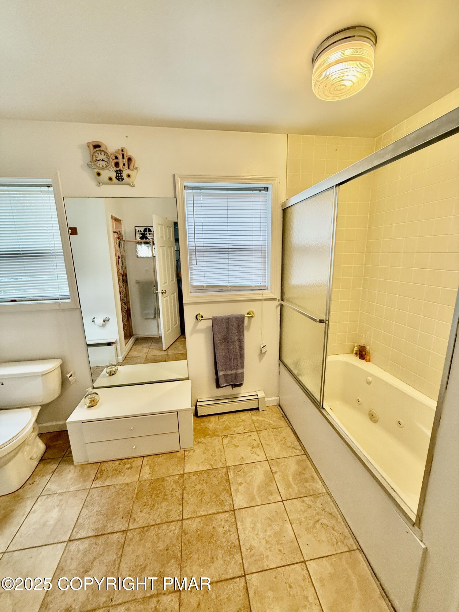 3224 Lakeview Drive Henryville, PA 18332 - Photo 23 of 48 a bathroom with a tub a toilet and a shower