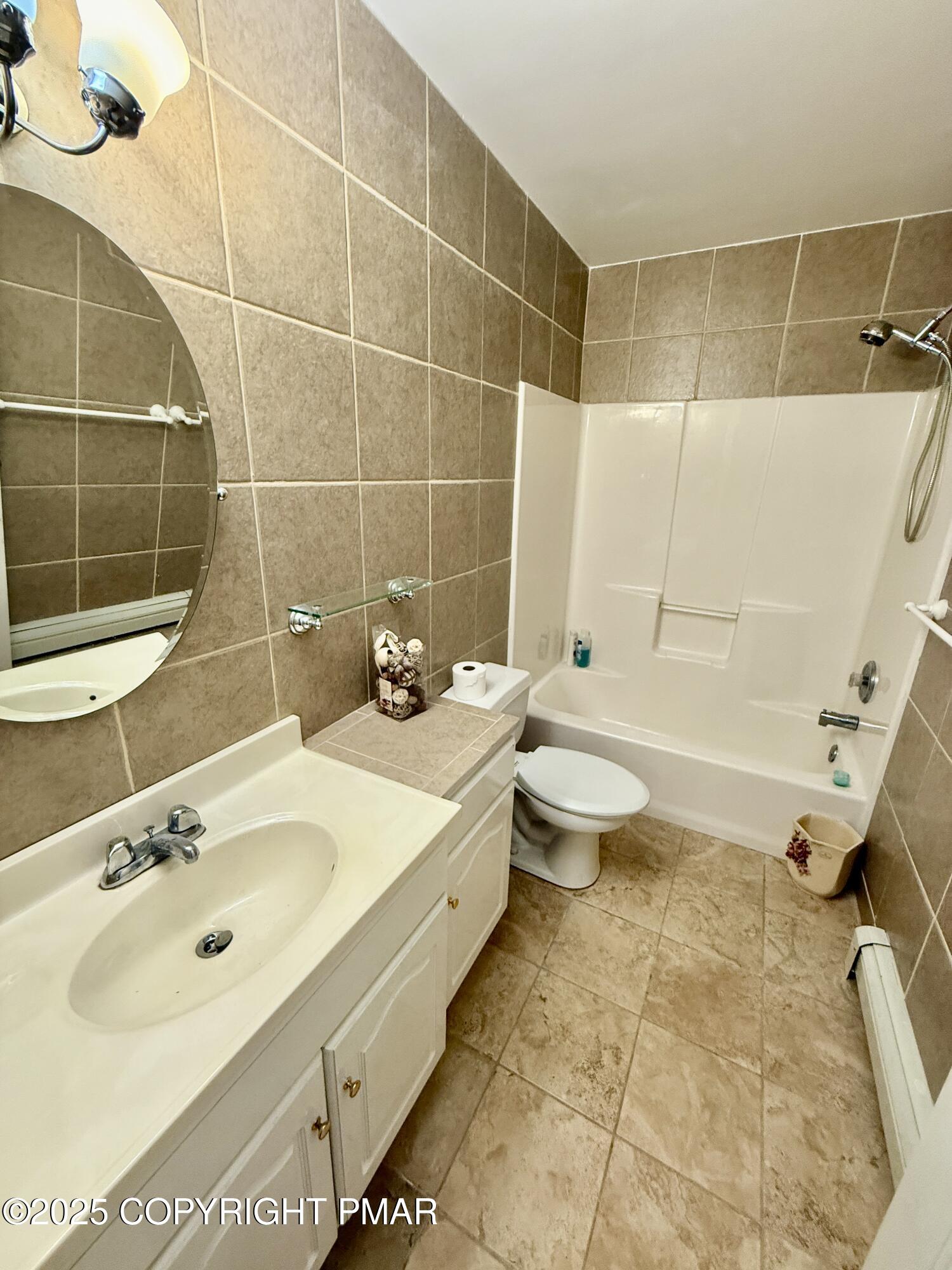 3224 Lakeview Drive Henryville, PA 18332 - Photo 37 of 48 a bathroom with a sink a toilet and shower