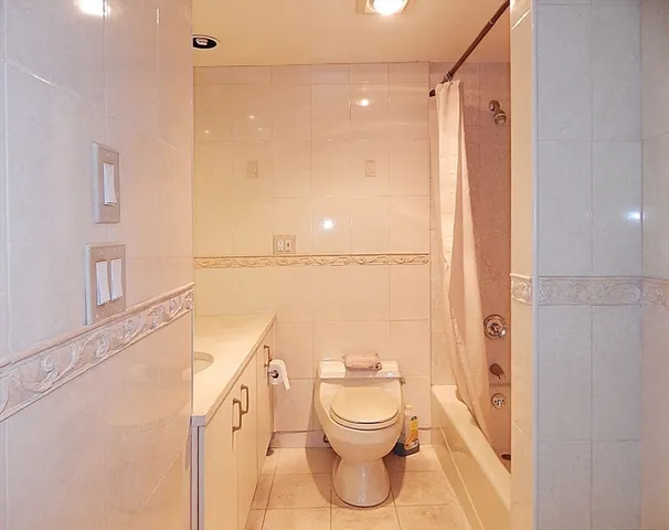 a bathroom with a toilet a sink and a shower