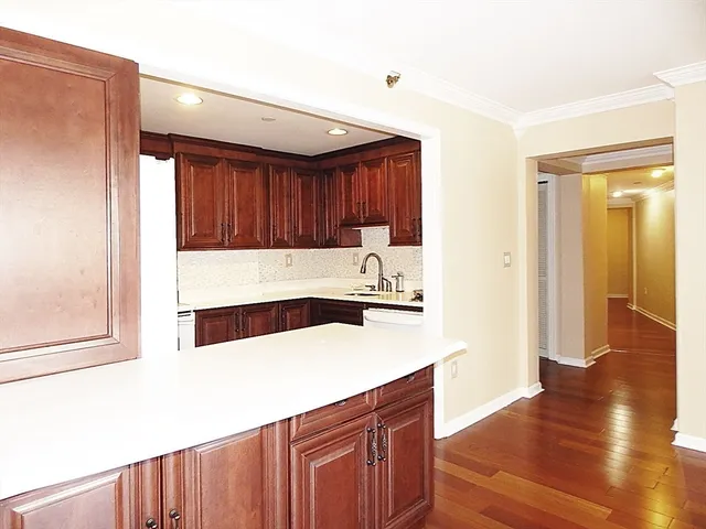 a kitchen with a sink and a refrigerator