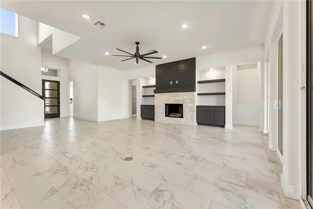 a view of kitchen with stainless steel appliances a refrigerator and a stove top oven