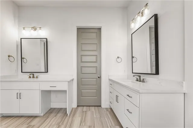 a bathroom with a sink a mirror and a shower
