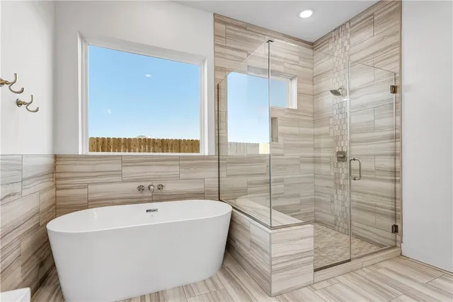 a bathroom with a sink a mirror and a bathtub