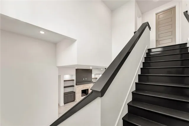 a bathroom with a granite countertop sink a toilet and a bathtub
