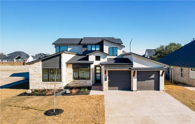 a front view of a house with yard